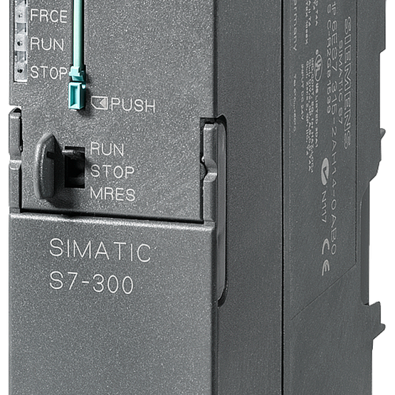 نمای نزدیک از یک دستگاه صنعتی کوچک با دکمه سبز