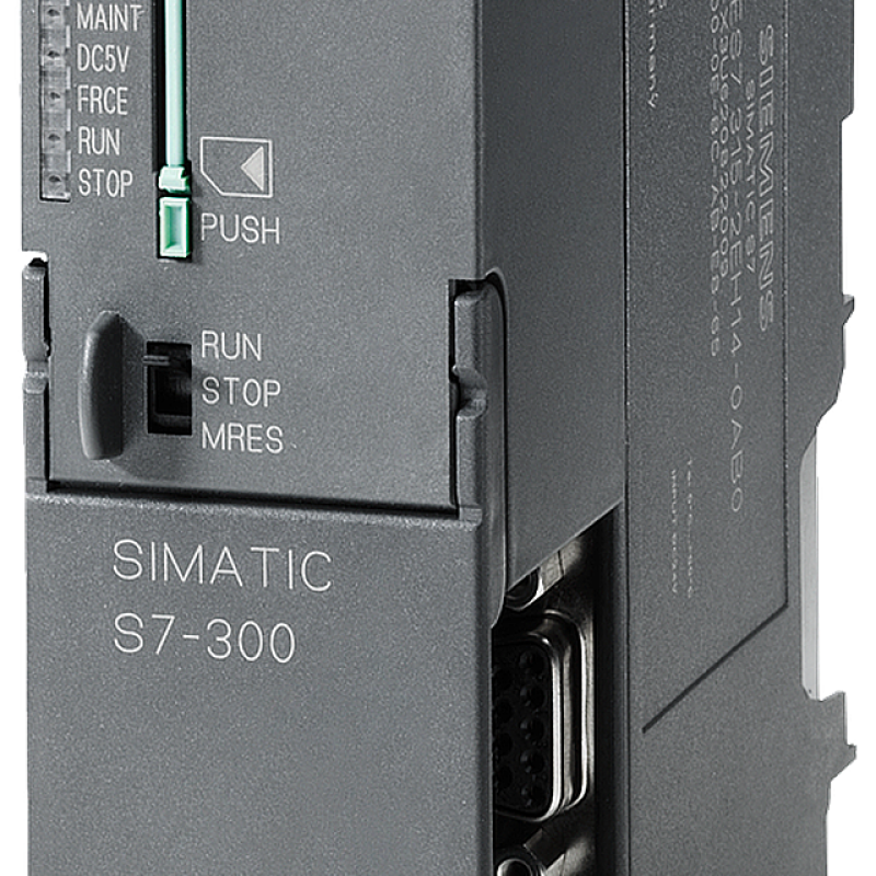 نمای نزدیک از یک دستگاه کوچک خاکستری و صنعتی با یک خروجی