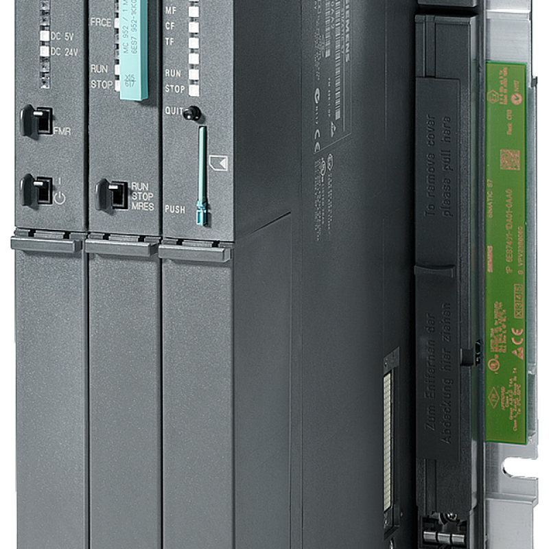 a close up of a machine with a green button on the front