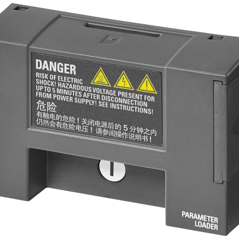 a close up of a black and yellow warning sign on a gray device